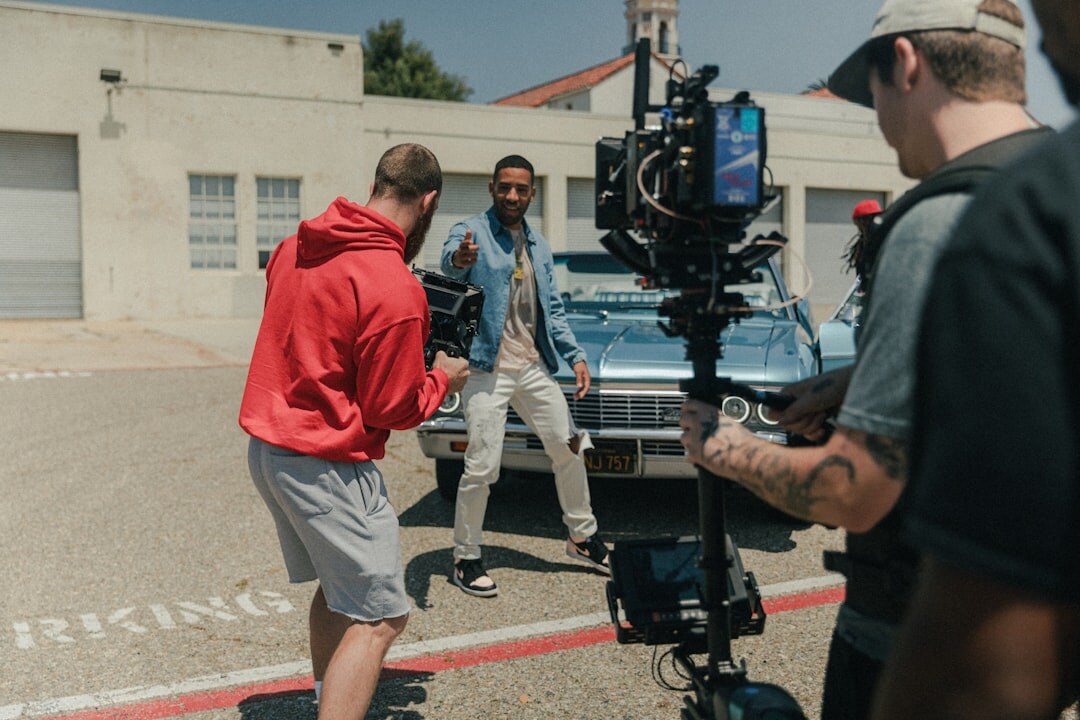 Two camera operators working together on a television studio set